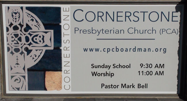 Sign out front with service times